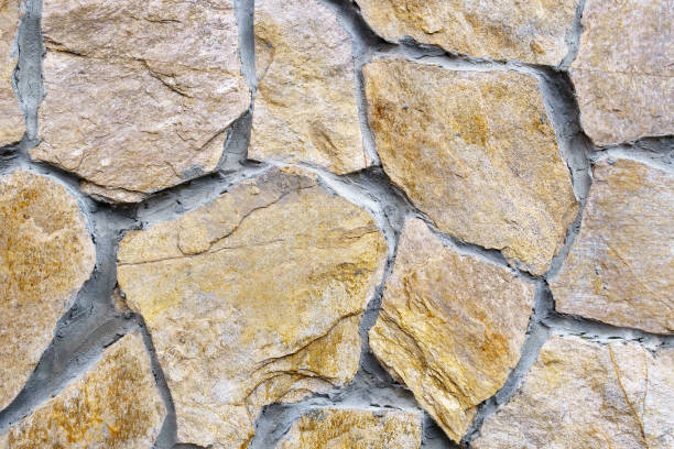 istock brown stone texture background abstraction. building wall. Close up 1302133893