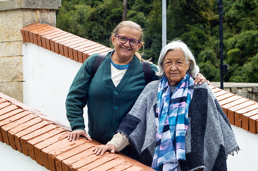 Senior mother and adult daughter traveling. The famous historic Bridge of Boyaca in Colombia. The Colombian independence Battle of Boyaca took place here on August 7, 1819.