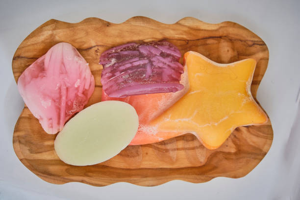 istock Wooden soap dish with multi-colored used soaps 1302135772