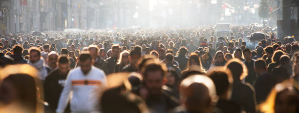 istock Blurred crowd of unrecognizable at the street 1302137232