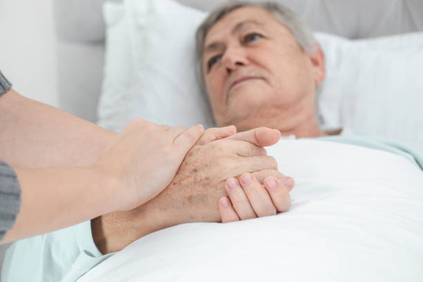 Techniques to Support Safe Movement in Bed for People Living with Parkinson's |Occupational therapist |Tripping hazards |Install handrails |Walking aids |Fine motor skills |Light switches |Poor lighting |Walking poles |Shower chair |Physical therapist |Own home |Electrical cords |Laser line