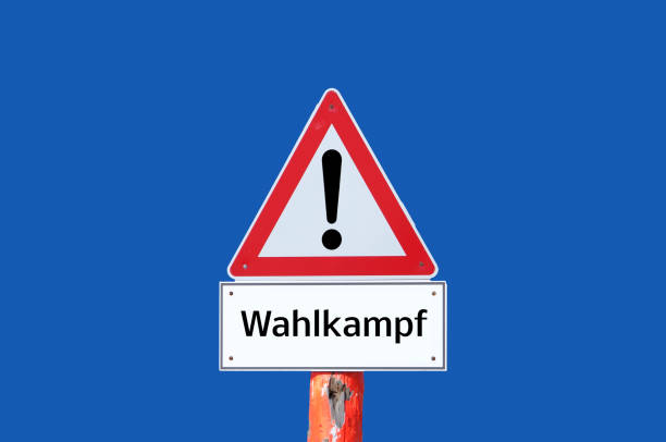 istock Caution warning sign election campaign on blue background in german 1302143247
