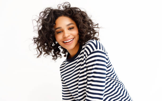 istock Happy ethnic woman with curly hair 1302143307