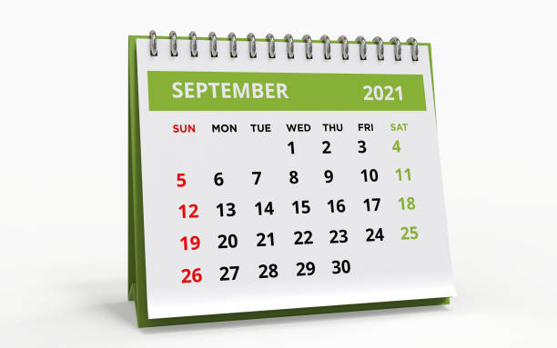 Standing Desk Calendar September 2021 Standing Desk Calendar September 2021. Business monthly calendar with metal spiral-bound, the week starts on Sunday. Monthly Pages on a white base and green title, isolated on a white background, 3d render. september calendar stock pictures, royalty-free photos & images