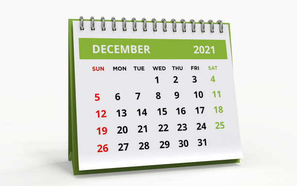Standing Desk Calendar December 2021 Standing Desk Calendar December 2021. Business monthly calendar with metal spiral-bound, the week starts on Sunday. Monthly Pages on a white base and green title, isolated on a white background, 3d render. december stock pictures, royalty-free photos & images
