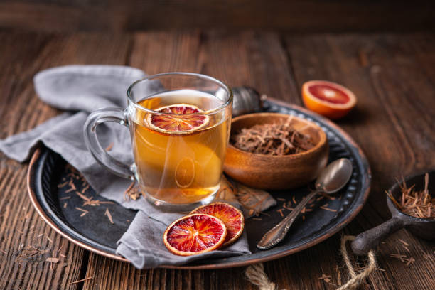 Medicinal Pau d'Arco bark tea also known as Lapacho in a glass cup stock photo