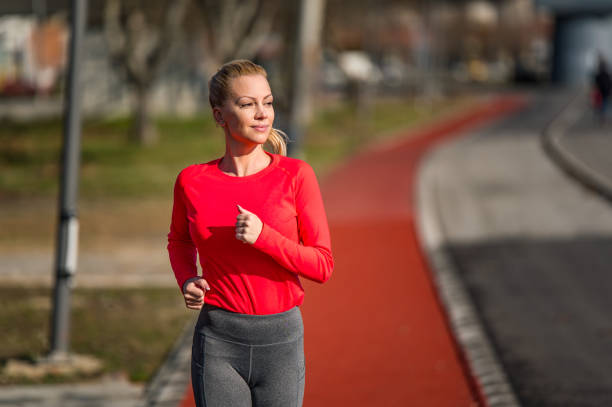 istock Young woman running. 1302150822
