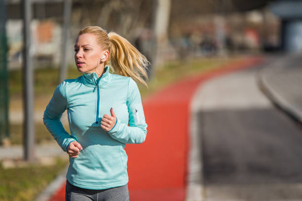 istock Young woman running. 1302150835