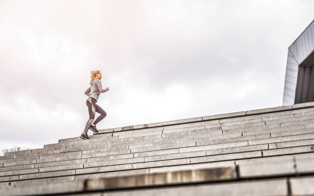 istock Young woman running outdoors. 1302151865