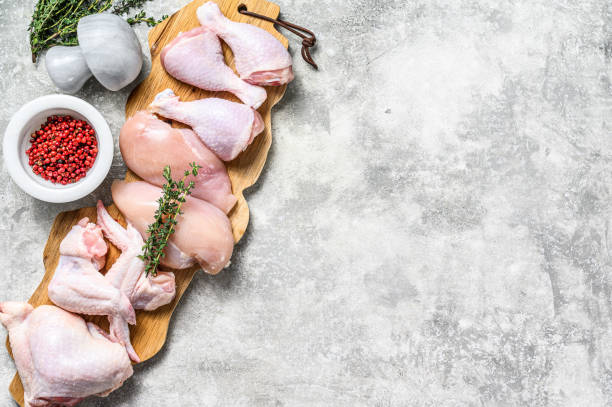istock Different types of raw chicken meat, poultry. Gray background. Top view. Copy space 1302153525