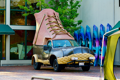 Freeport, Maine / USA - June 30, 2019: The original L.L. Bean “Bootmobile” parked outside of the global company’s flagship store and corporate headquarters.