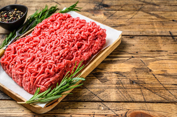 istock Raw Mince Ground meat. wooden background. Top view. Copy space 1302155958