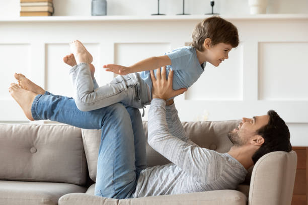 istock Happy dad play at home with small son 1302155967