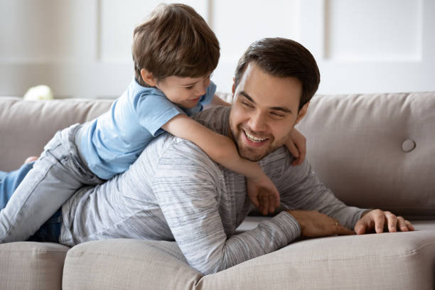 istock Happy child have fun playing with loving dad 1302155974
