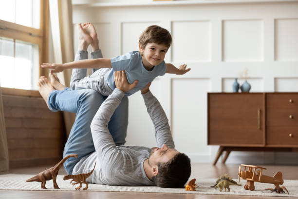 istock Loving young dad have fun play with happy son 1302155989