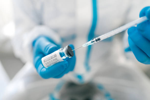 istock injecting the covid19 vaccine from the vial 1302156897