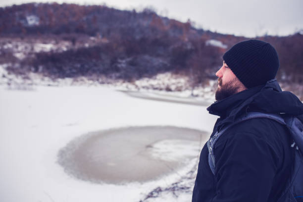 istock Exploring winter frozen lake 1302157425