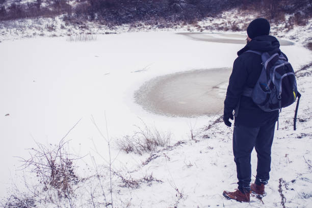 istock Exploring winter frozen lake 1302157439