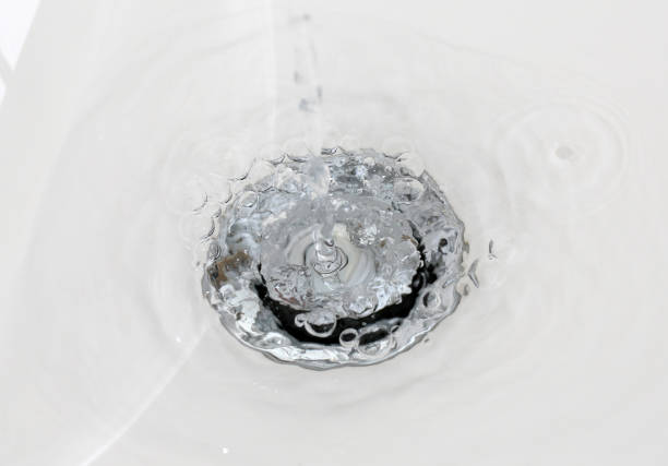 Drainage of water from the sink that foams in the new clean bathroom