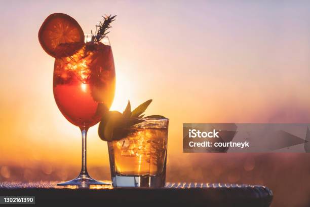 Two Cocktails At Sunset Stock Photo - Download Image Now - Cocktail, Cocktail Party, Sunset