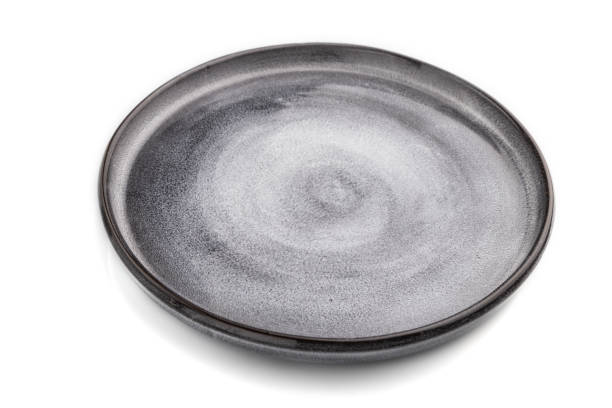 istock Empty gray ceramic plate isolated on white background. Side view, close up. 1302162347