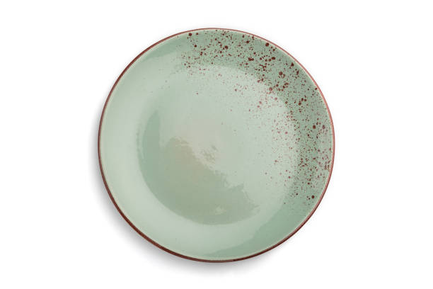 istock Empty blue dotted ceramic plate isolated on white background. Top view, close up. 1302162435