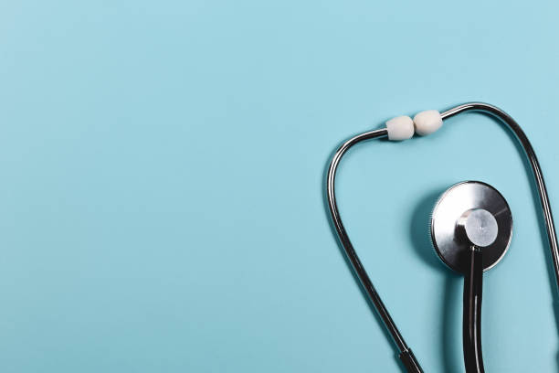 istock Medical concept. Stethoscope on a blue background. Flat style, top view. 1302165288