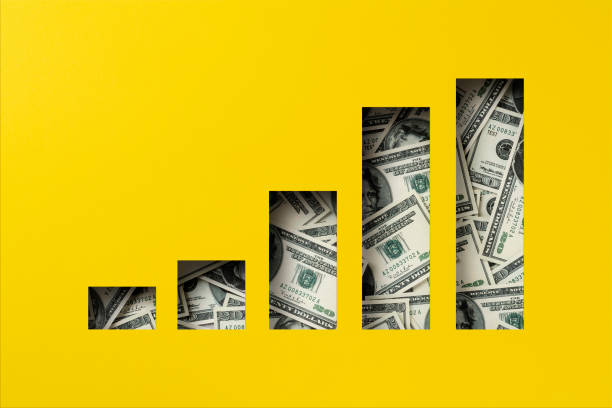 istock American dollar heap under paper cutout bar graoh icon 1302166097
