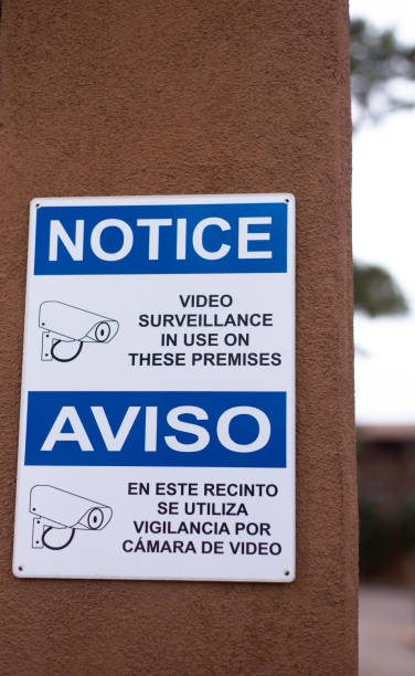 istock Bilingual Notice of Video Surveillance 1302168748