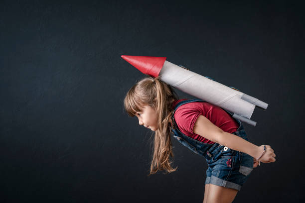 istock Young Business Girl with Rocket Pack 1302168858