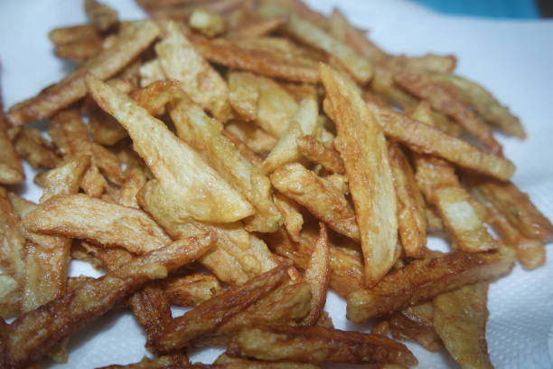 istock Potato fried or roasted slices on clean background with copy space for text 1302171007