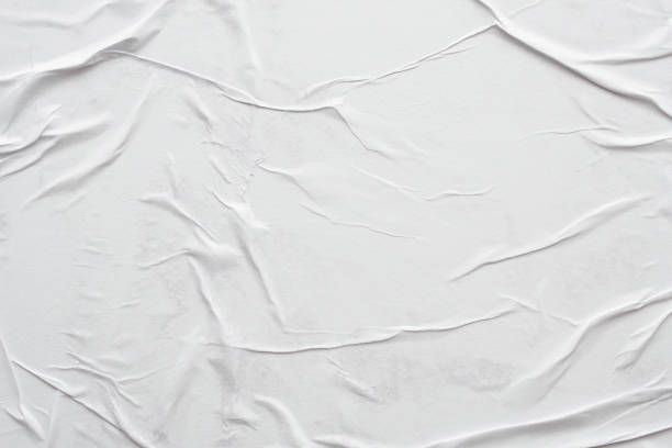 istock Blank white crumpled and creased paper poster texture background 1302174687
