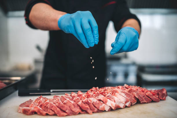 istock Chef prepare pork steaks for the barbeque 1302174711