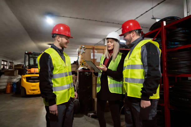 istock Warehouse manager and male workers doing stocktaking of product in a warehouse by using a digital tablet 1302175019