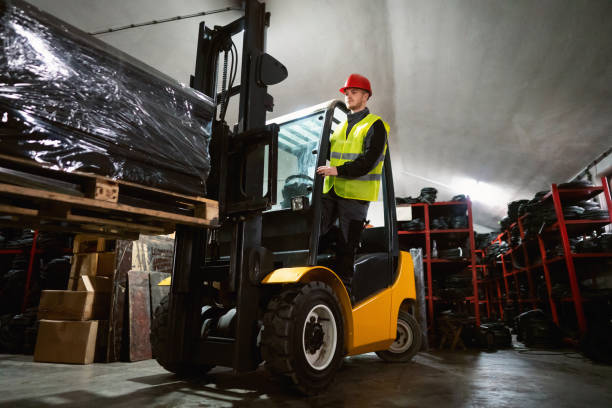 istock One young male forklift driver moving stack of rubber mats 1302175040