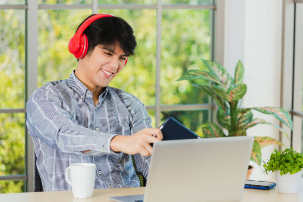 istock business man using digital tablet play racing online video games 1302182264