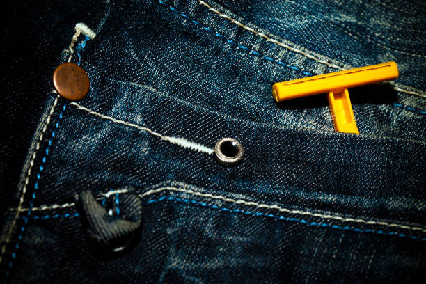 Old Jean Pant and Razor Blade on pocket Photo