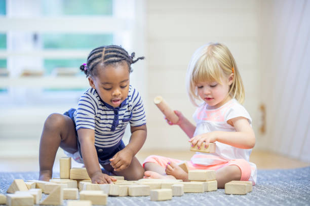 istock Two preschool children playing together 1302192950