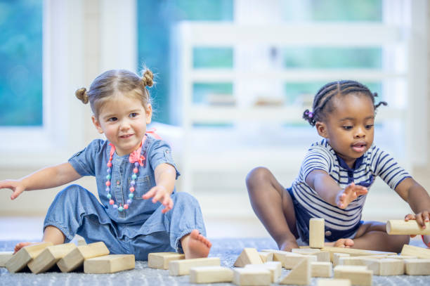 istock Two preschool children playing together 1302192960