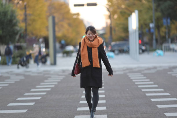 istock Beautiful young woman warking on plaza 1302195748