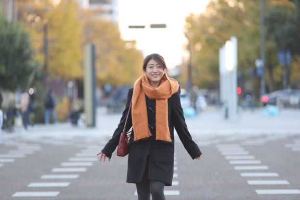 istock Beautiful young woman warking on plaza 1302195762