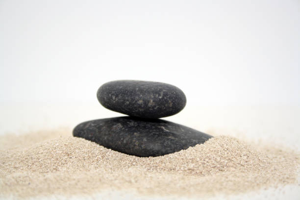 istock Sea round stones on the fine sand. Selective focus. 1302199357