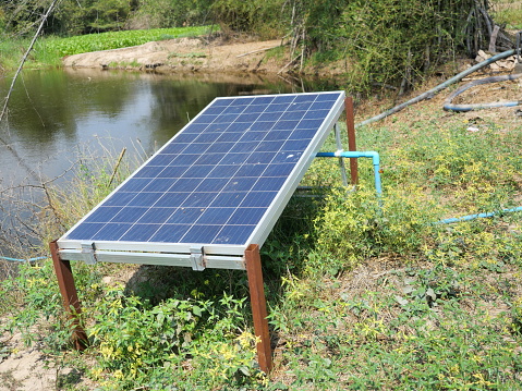 Generate electricity to power the pump in the pond by solar cell panel, Environmentally friendly technology at farm in Thailand