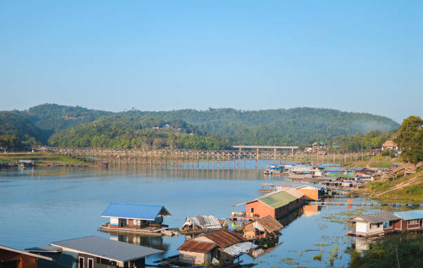 istock Many wooden house floating on the river. 1302203645