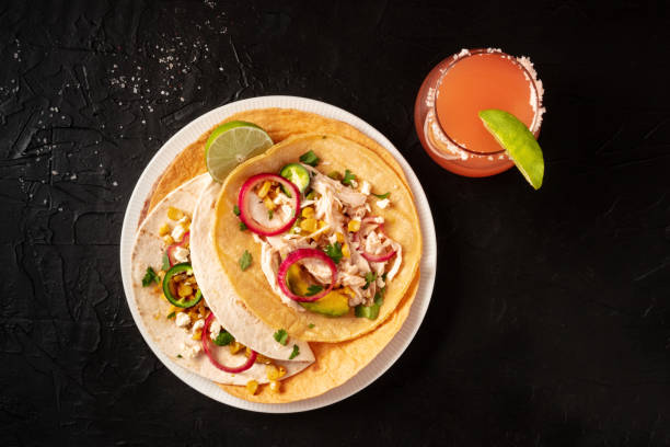 istock Mexican tacos, tortillas with pulled chicken and avocado 1302204479