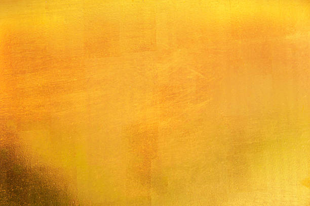 istock grunge gold abstract background or texture and gradients shadow 1302205725