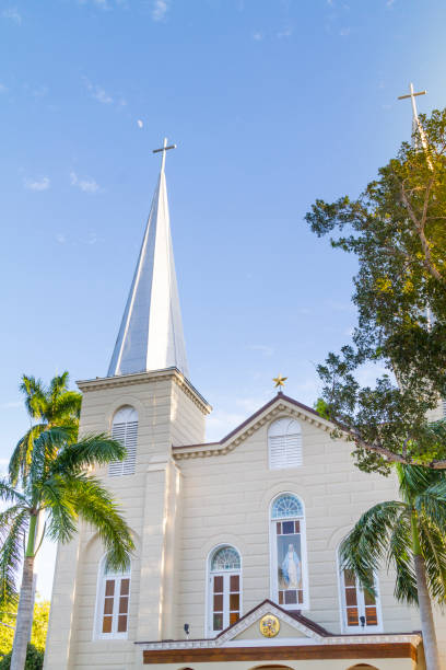 Key West, Florida, USA - December 30, 2020: General landscape view of traditional architecture in Key West on a sunny winter day before New Year's Eve. The city is completed empty during the Corona Virus Breakdown Illness Pandemic. Beautiful picture as street photography style.