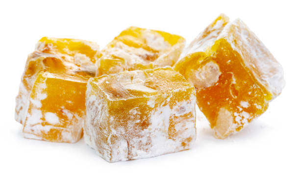 istock Yellow Turkish Delight sweets isolated on white 1302207790
