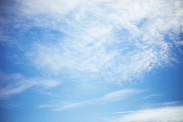 istock Blue sky background and white clouds soft focus, and copy space 1302210561