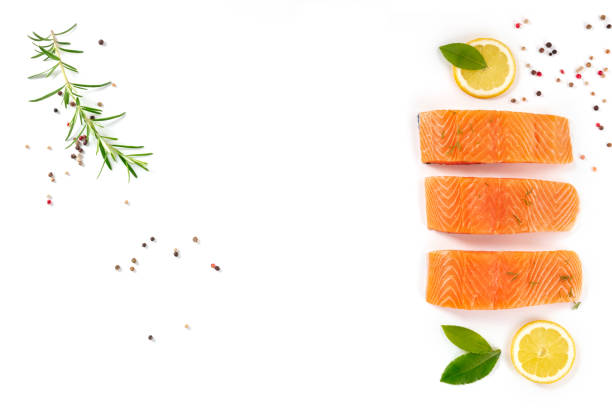 istock Fresh salmon banner design, overhead flat lay with herbs, lemons and spices 1302210767